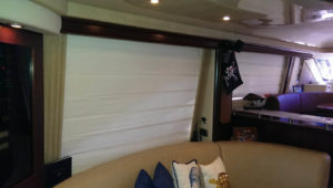 Roman shades are a popular choice because they give a yacht interior a very soft yet refined look.