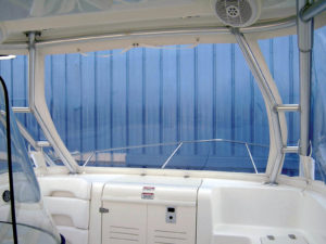 Inside view of a 32-foot Boston Whaler. Notice how the vertical zippers follow the legs of the hard top for greater visibility. Front enclosure panel unzips at the bottom along with both sides to gain access to the bow.