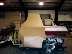 Key to building a successful boat cover is a good pattern. The best patterning material depends largely on the size and the style of cover and the boat's location. When boats are trailered to the canvas shop, fabricators can pull patterns while protected from the weather, using craft paper. The paper comes in a variety of widths ans is easy to correct and store. Photo: Paul Charpentier.