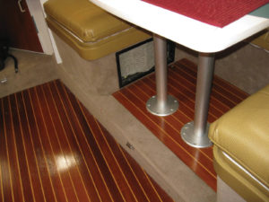 This faux ostrich was selected to blend with the rich colors of the teak and holly floor.