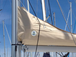 A lazy jack sail cover features Elliott's distinctive shop logo.  