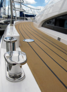 AmeriTeak Marine’s Dek-King Weld synthetic flooring is adhered directly to the deck underneath, and even recreates the grout lines of real teak flooring.