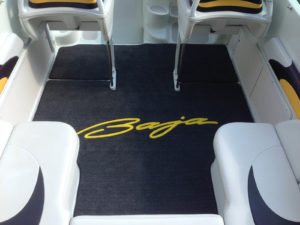 This example of AquaMat from Corinthian Marine Carpet gets a pop of color from an inlaid logo.