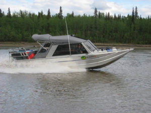 By cantilevering an existing ridged frame, shelter can be extended to cover passengers while they fish. The shelter does not interfere with fishing poles.