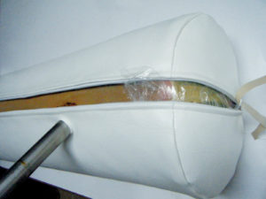 This white Jacuzzi cushion was fabricated with the zippers extending into the side ends in order to insert the interior into the cover. The pole placement cut-outs were underneath the cushion zipper.