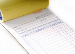 An invoice pad turned to a blank page.