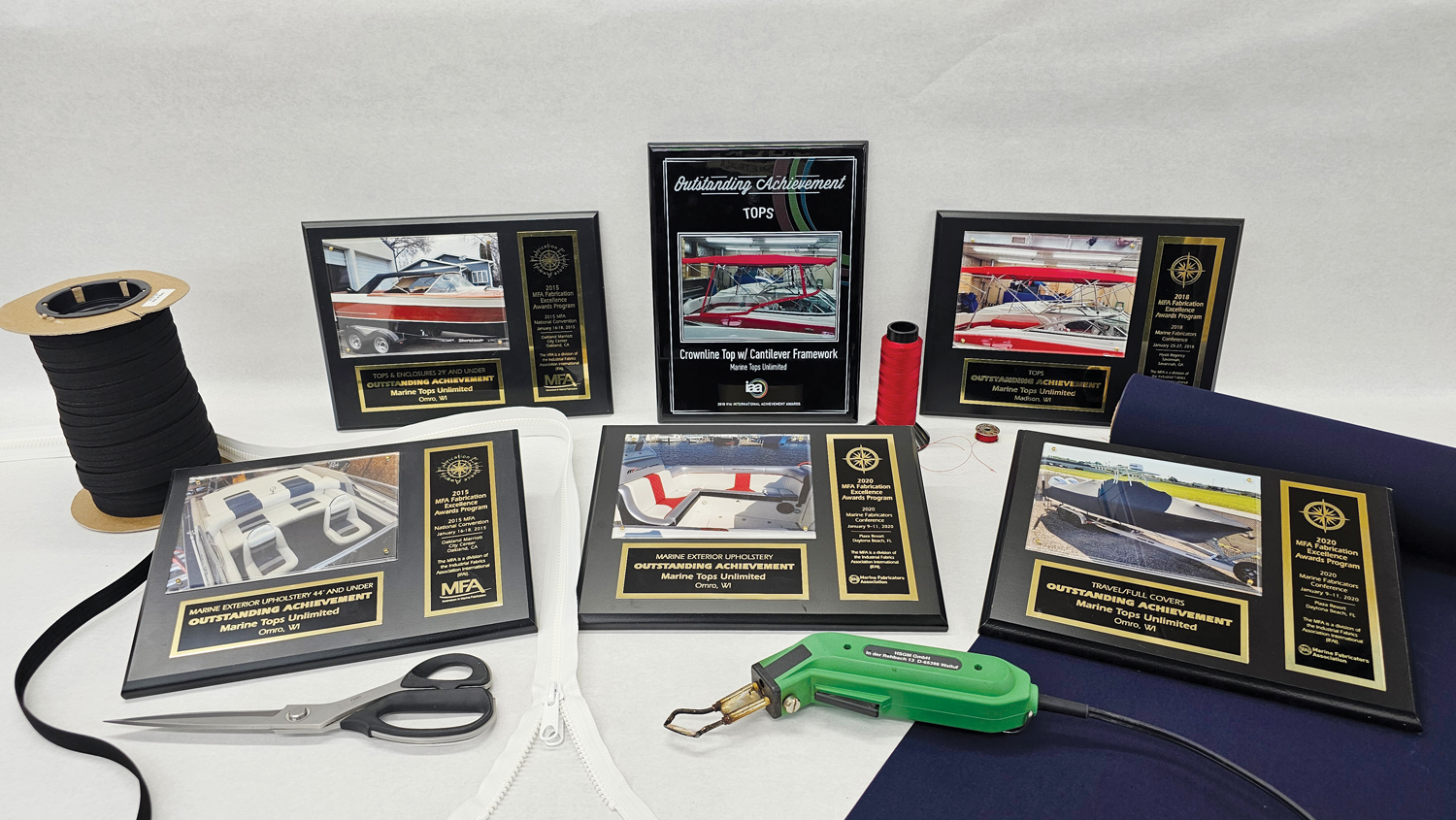 Six award plaques from Marine Tops Unlimited.
