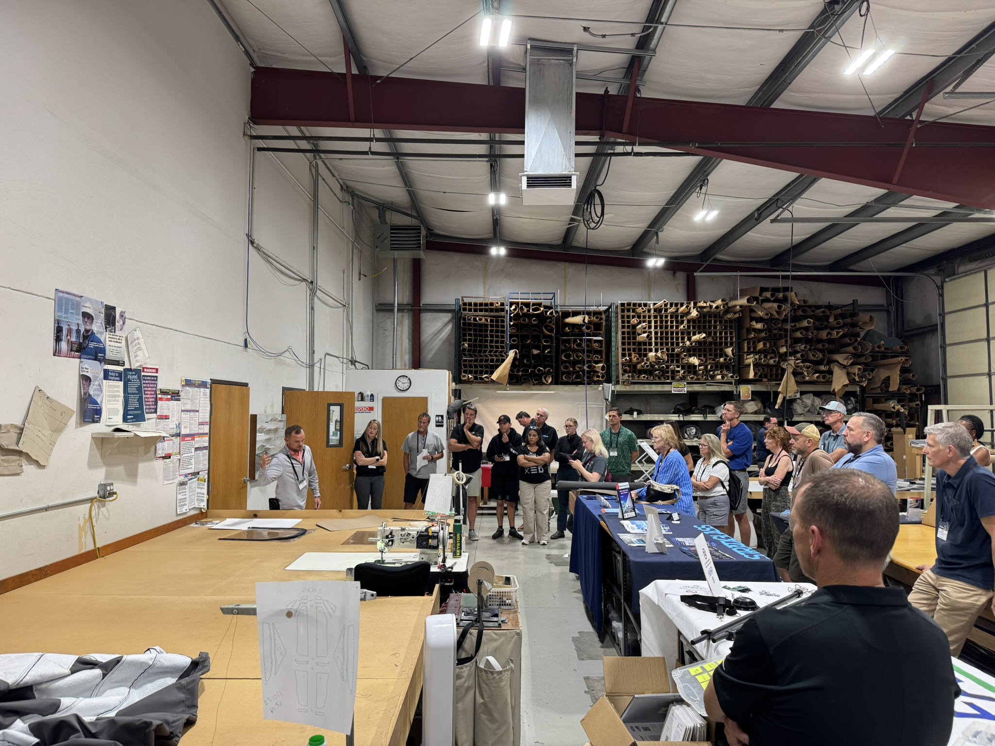 Steven Wayne shows a demonstration to a standing crowd of fabricators.