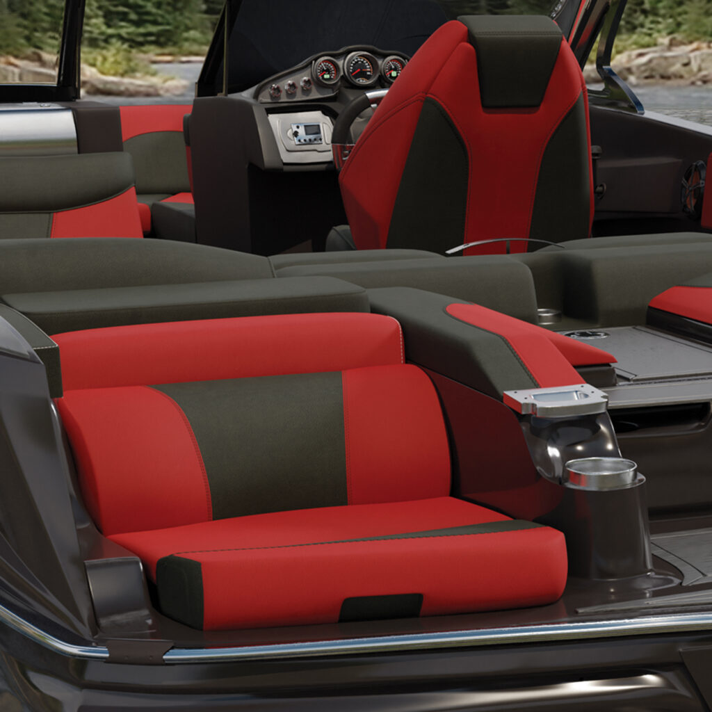 Red and black upholstered seats arranged in a sleek boat interior.