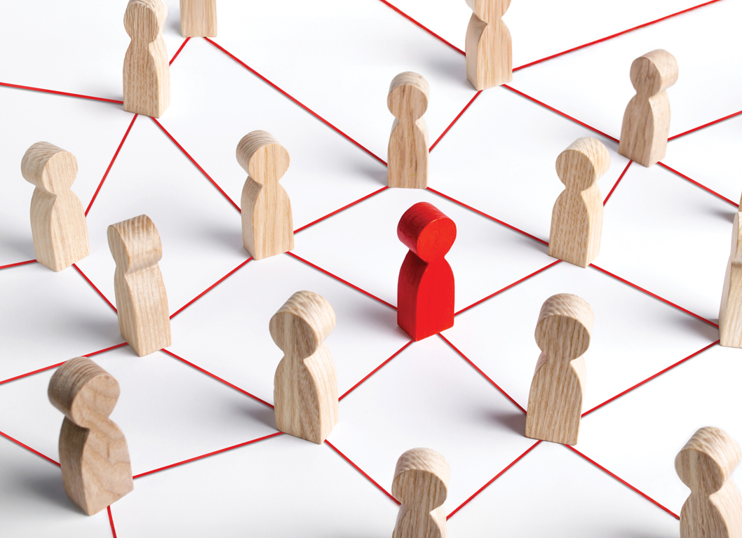 Red and wooden figures connected by red lines on a white background, symbolizing networking and social connections.