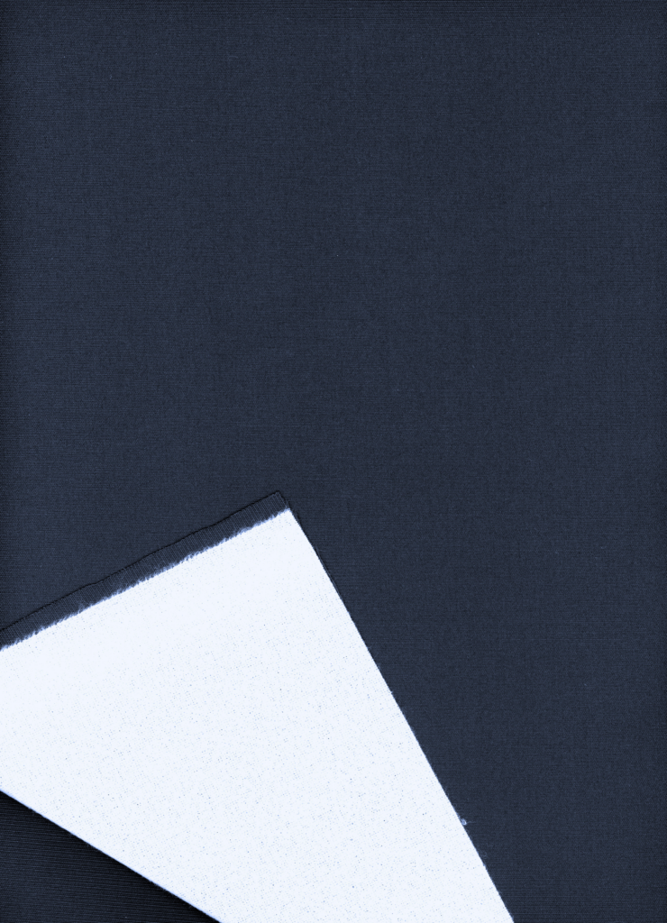 Deep navy fabric with a glossy finish, featuring a folded edge revealing a contrasting white underside.